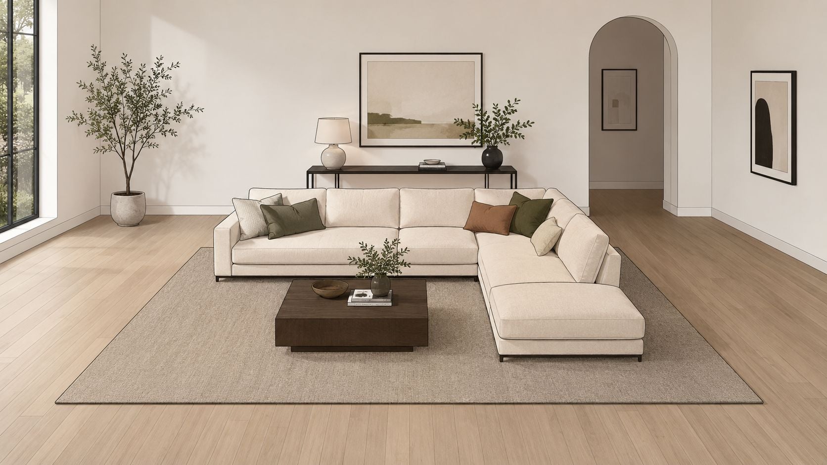 A modern cream-colored sectional sofa with decorative pillows arranged in a bright, minimalist living room interior.