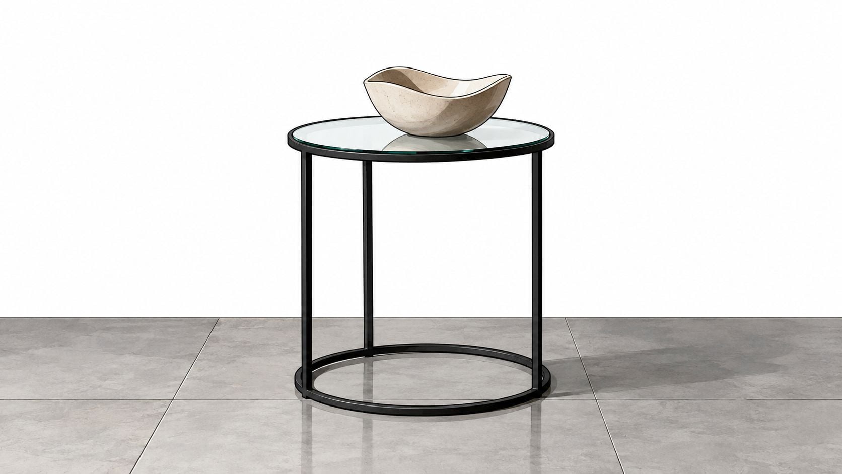 A modern round end table with a black metal frame and glass top holding a decorative bowl.